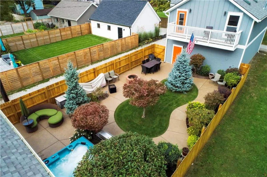 Your private downtown Indy home base, minutes from Mass Ave, Bottleworks, major venues, dining, and nightlife. Downtown Indianapolis vacation rental near Mass Ave and Bottleworks with private hot tub, fenced backyard, free parking, and space for 8 guests